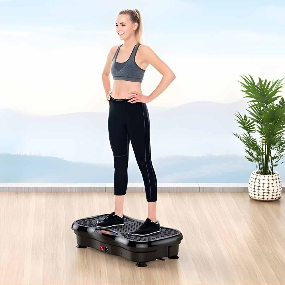 woman standing on a vibration plate fitness machine during a home workout